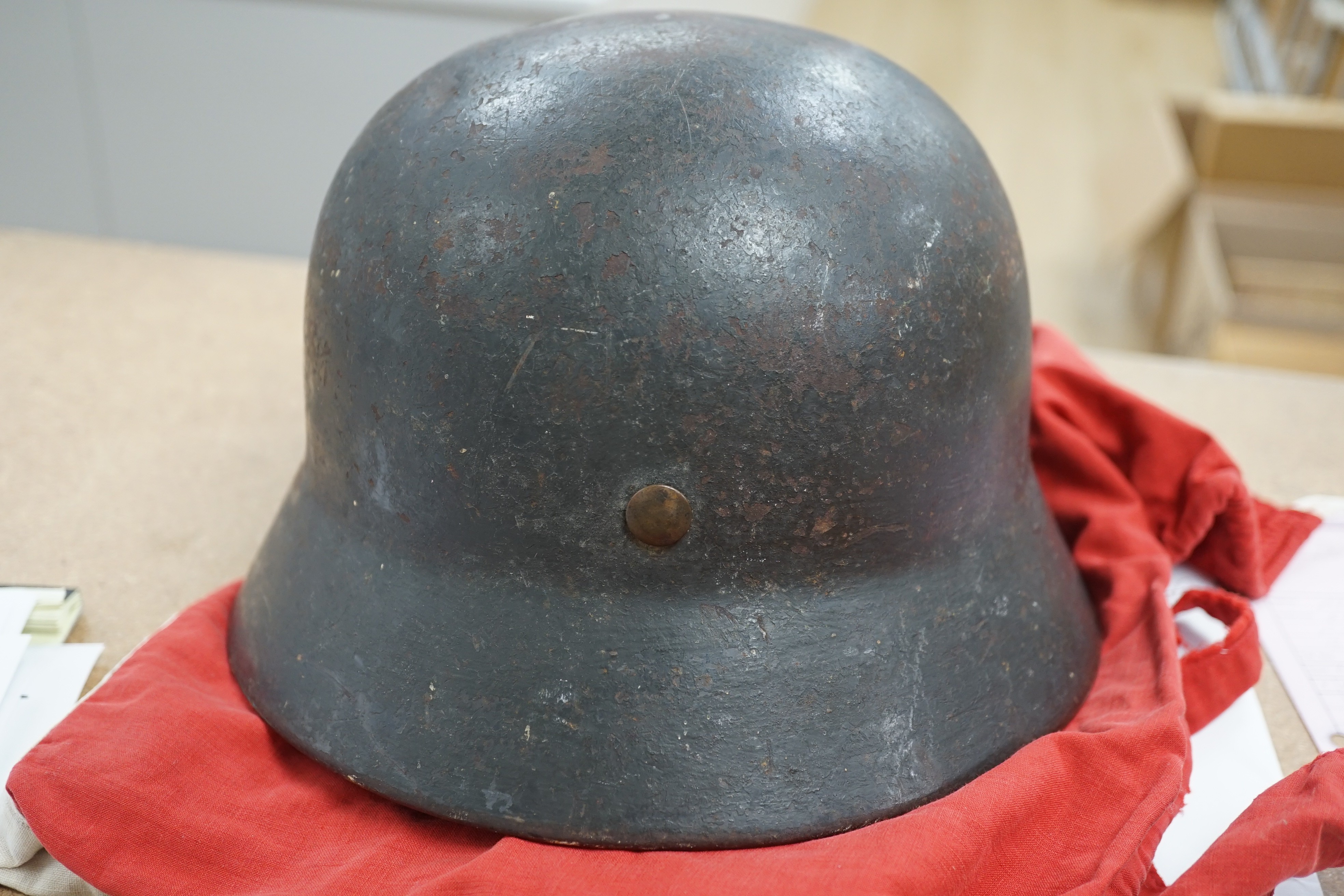 A Third Reich SS dagger, German steel helmet and a Nazi flag